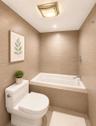 White built-in bathtub with chrome fixtures, surrounded by neutral-toned wall tiles
