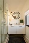Floating vanity with concealed hardware, quartz countertop, and undermount sink