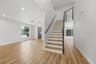Entry way showcasing modern cable stair railing