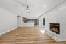 Floor-to-ceiling fluted tile fireplace
