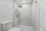 Feauturing a gorgeous porcelain-tiled walk-in shower