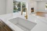 Seamlessly opening into the living area for an ideal layout for entertaining and daily living