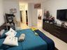 White walls with light-colored tile flooring