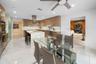 Kitchen featuring a waterfall island, integrated stainless steel appliances, contemporary cabinetry, a tile backsplash, and recessed lighting