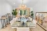 Vaulted ceiling, recessed lighting, tile flooring, window with custom valance, and decorative chandelier