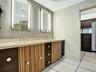 Double vanity with integrated sinks and stone countertop