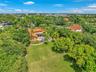 Expansive property featuring a large lawn, a private swimming pool, and a terracotta tile roof