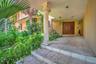 Tile steps leading to a covered entry with a decorative column