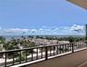 Expansive ocean horizon, lush tropical landscaping, and contemporary architecture