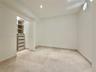 Recessed lighting, built-in closet storage with drawers, built-in shelving, a round window, and large format tile flooring