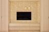Integrated entertainment center with textured wall finish, wood-finish cabinetry, and glass countertop