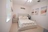 White interior walls complemented by wood-finish flooring