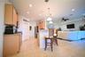 Kitchen featuring recessed lighting, wood-finish cabinetry, granite countertops, and stainless steel appliances