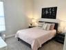 Plush carpeting, window with blinds, and recessed lighting