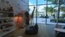 Floor-to-ceiling windows, patterned accent wall, built-in shelving, recessed lighting, and direct exterior access