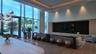 Spacious room featuring floor-to-ceiling windows, recessed lighting, and wood-finish flooring