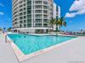 Outdoor swimming pool with concrete decking