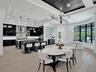 Coffered ceiling with dark-toned plank inlay, recessed lighting, wood-finish flooring, iron chandelier, and high-gloss cabinetry