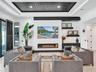 Coffered ceiling featuring dark wood-finish planking, linear fireplace with a textured surround, recessed lighting, multi-panel glass sliding doors, a