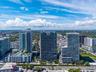 High-rise residential towers featuring glass facades and private balconies