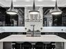 Polished black stone surface featuring high-contrast white veining