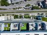 High-rise terrace featuring concrete dividers, synthetic grass surfacing, and private outdoor space