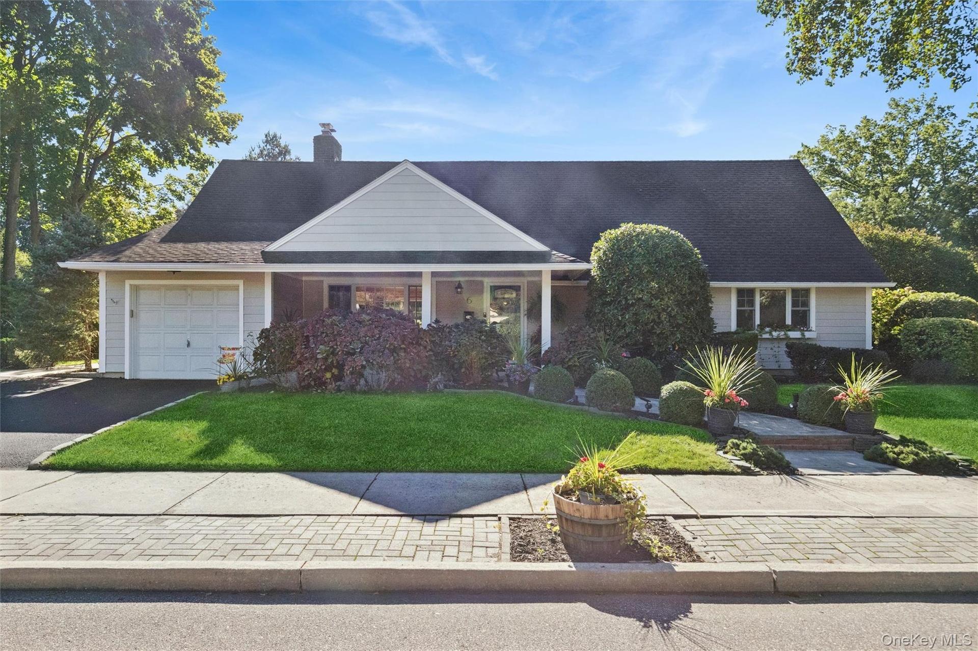 This 4B expanded cape home is located in the Franklin Court Mews neighborhood of Garden City.