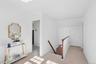 Generous upstairs landing with extra storage space in the extended eaves over the front porch