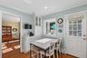 Custom cabinets by Ken Kelly Inc. paired with sleek quartz countertops and stainless steel appliances make this a showstopper!