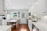 The heart of the home is the stunning 2014 eat -in kitchen with access to the entertaining patio