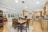 Open floor plan, dining into kitchen, dining into living room with fireplace