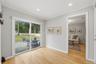 Sliding glass doors off of the kitchen to the patio and backyard