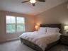 Main Bedroom with ceiling fan and river views