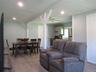 Open concept Living area with recessed lighting and ceiling fan