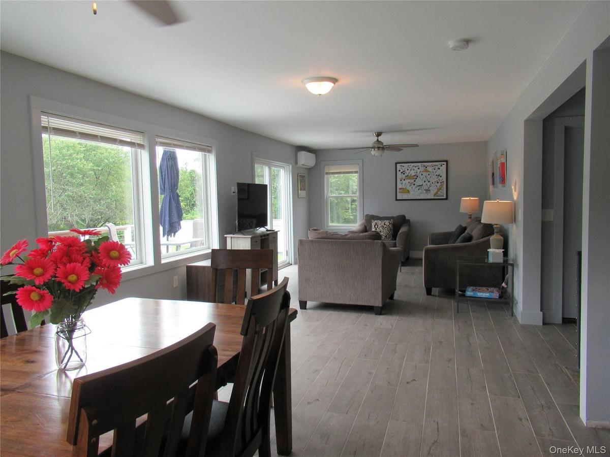 Easy care tile floor and wall of glass doors and windows for those river views