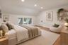 2nd floor bedroom Sloped ceilings featuring recessed lighting, inset windows, wood-finish flooring, and wall-mounted wooden shelving