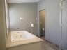 Main en-suite featuring a Jacuzzi tub plus water closet