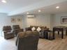 Lower level entertainment space with walk out to patio area