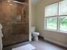 Full bath for bedroom #1 with walk in tile shower.