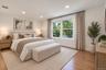 2nd floor Bedroom featuring wood-finish flooring, recessed lighting, and a large double-pane window with white trim