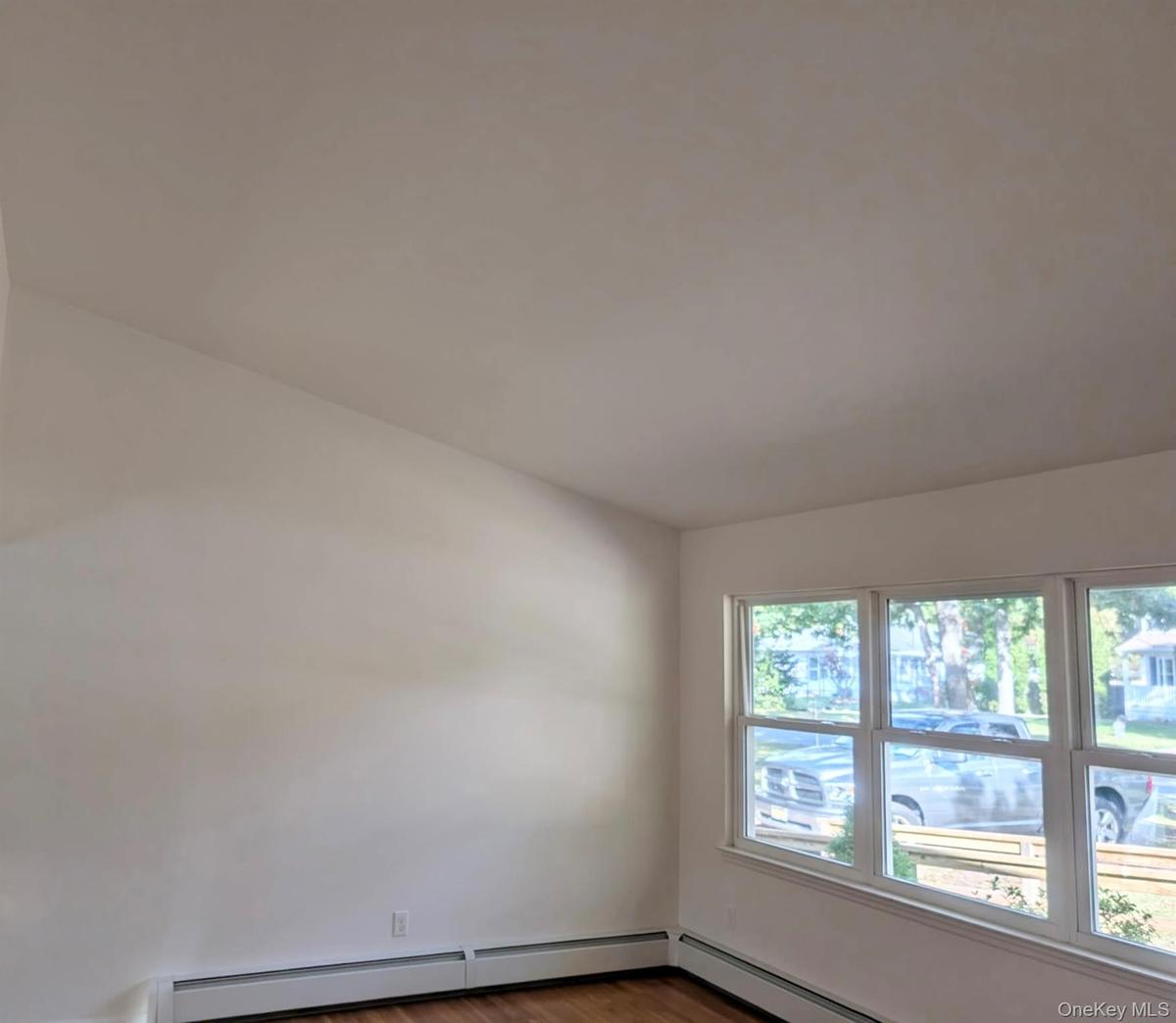 Cathedral ceiling, hard wood floors, and newer multi-pane windows