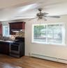 ...dining area, large double window and ceiling fan with integrated lighting.