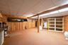 full basement with outside entrance to the garage.