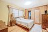 Primary bedroom with hardwood floors