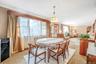Bright dining area open to living room