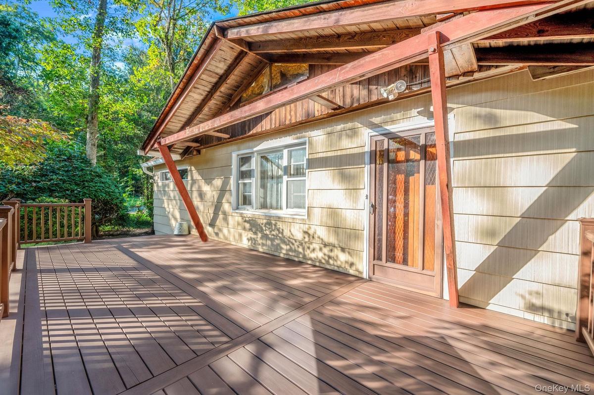 expansive deck over looking the beautiful front yard