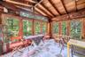 Sunroom with slate floor overlooking the beautiful wooded lot