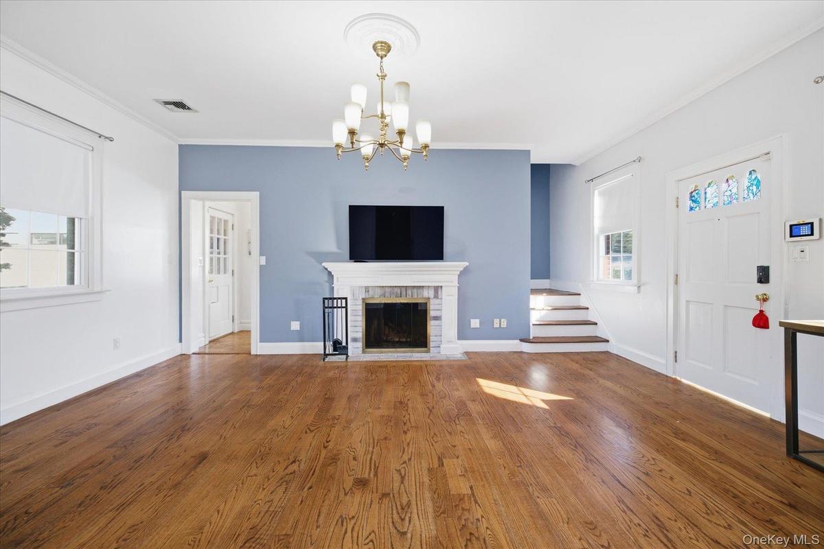 living room with wood burning fireplace