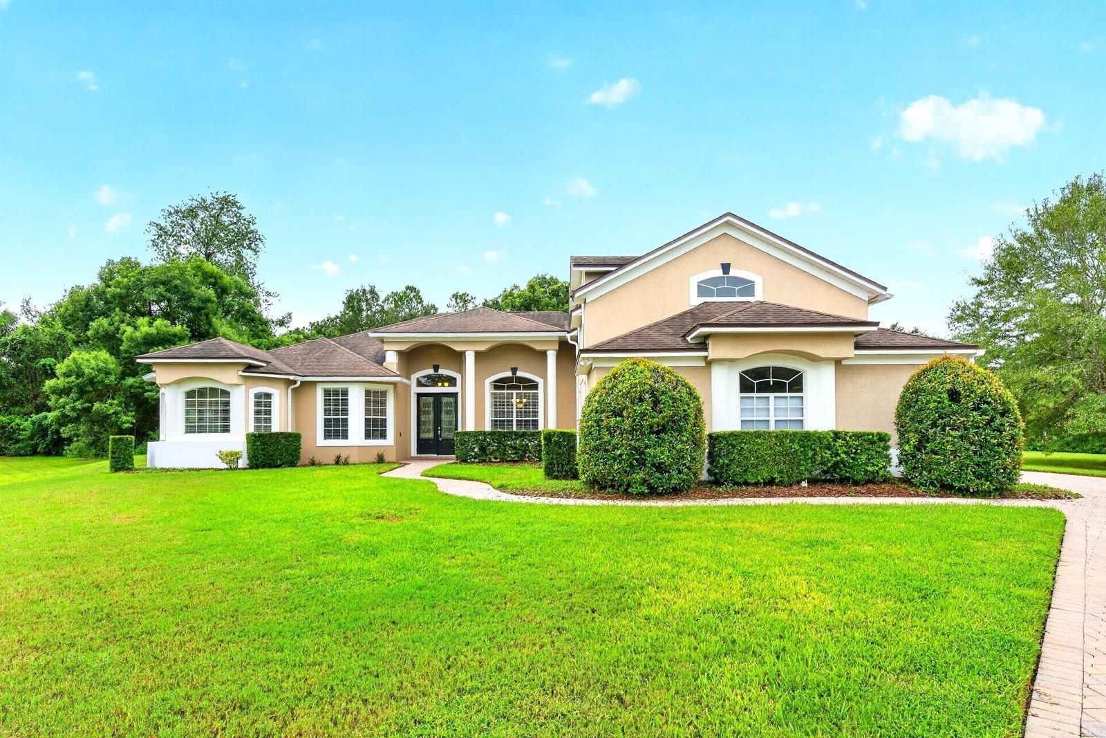 Space, privacy, and exceptional features define this impressive 5-bedroom, 3.5-bath POOL HOME in the GATED Seville Chase community of Winter Springs!