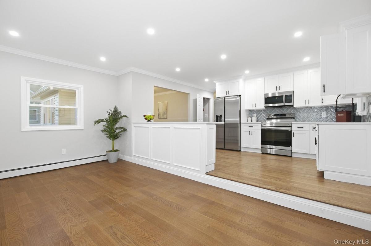 Den off of the Kitchen creates a space perfect for being a part of everything while preparing meals.